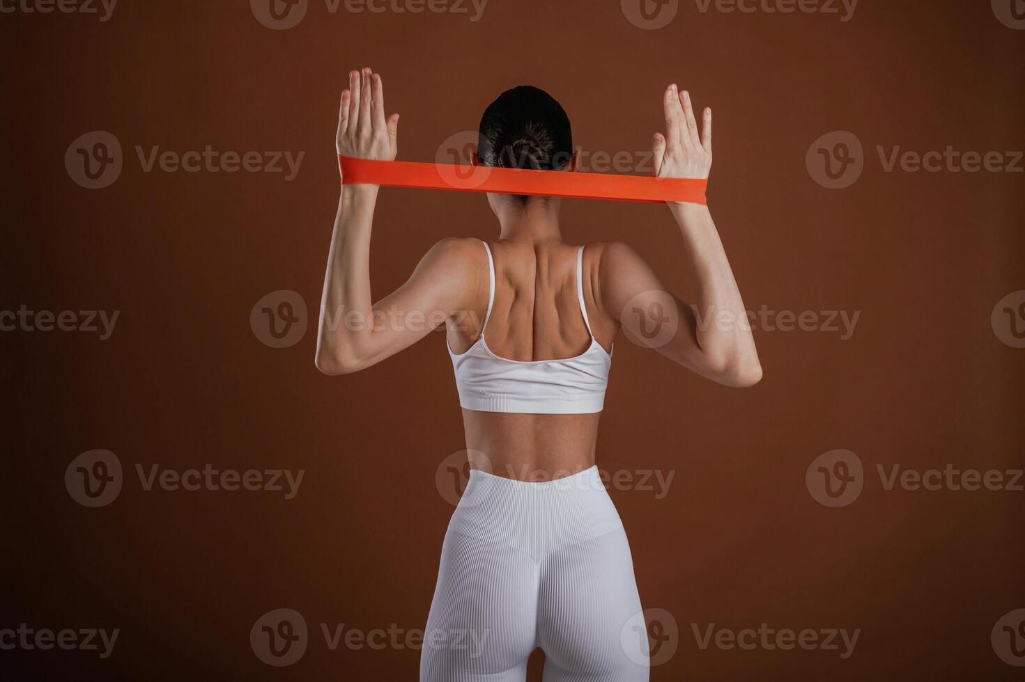 Stretching the hands. ,Beautiful fitness woman is in the studio photo