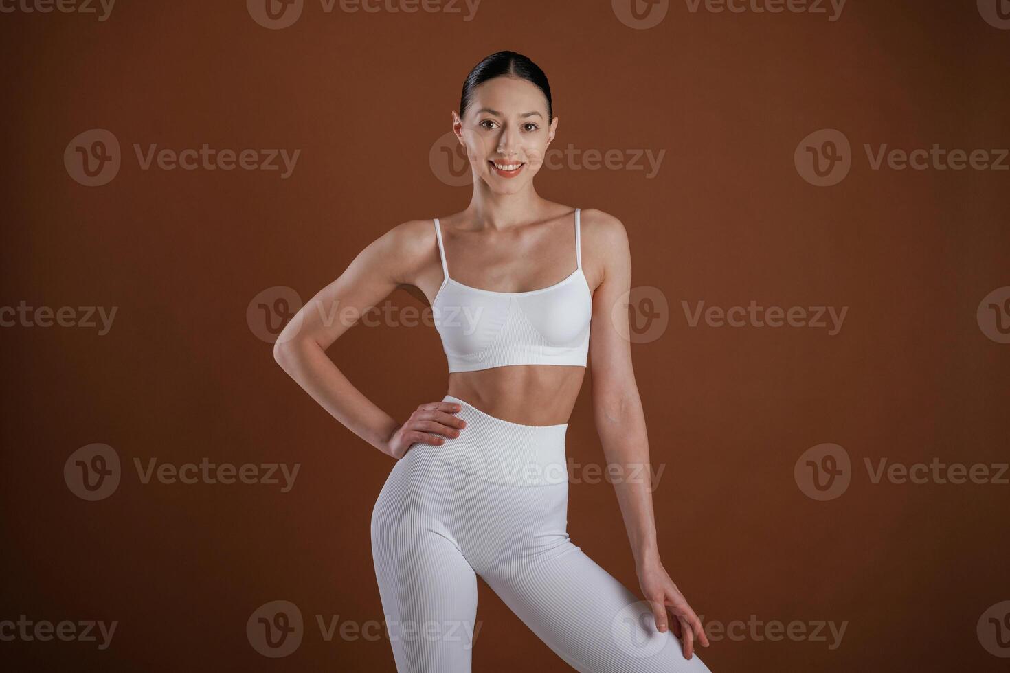 Front ,view. Beautiful fitness, woman, is in the studio photo