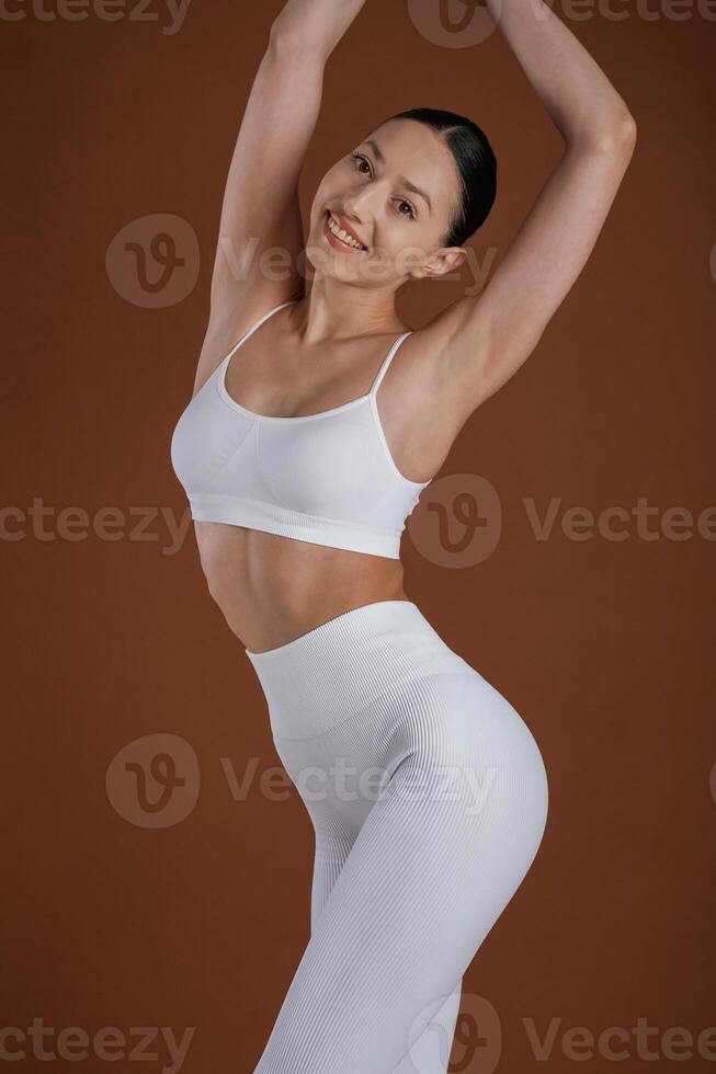 Front ,view. Beautiful ,fitness woman is in the studio photo