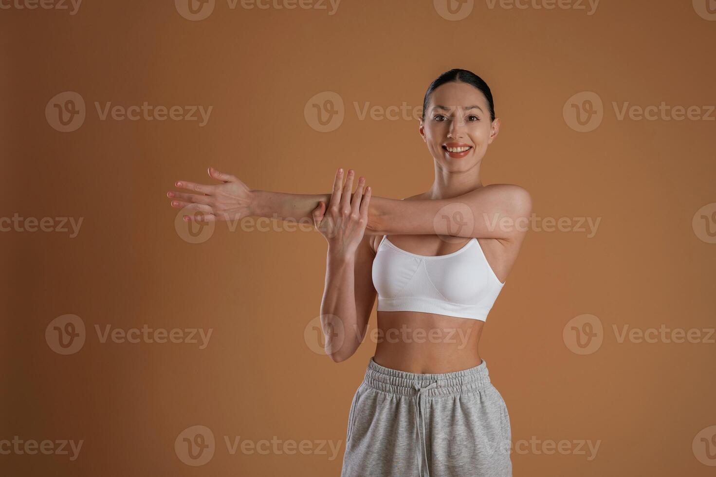 Beautiful, fitness woman is in the studio photo