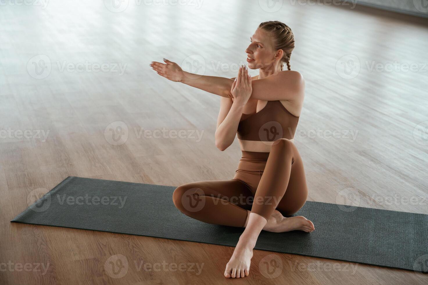 Front view.,, Warm up exercises. Fitness, woman in sportswear is indoors photo