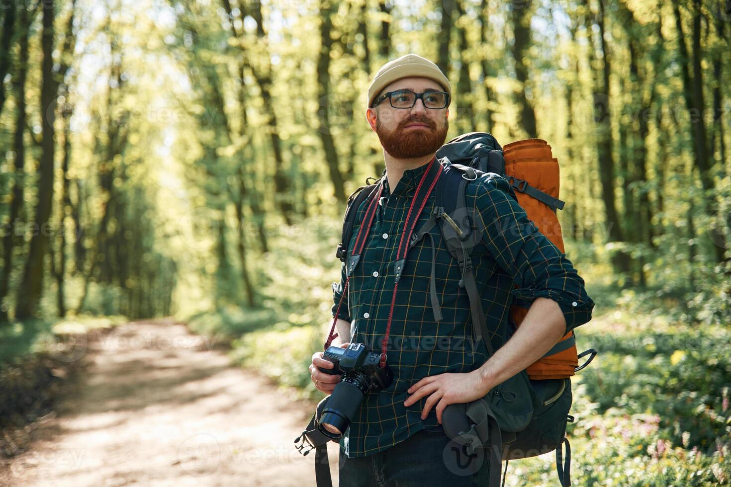 Front view. ,,Bearded man is in the forest at daytime photo