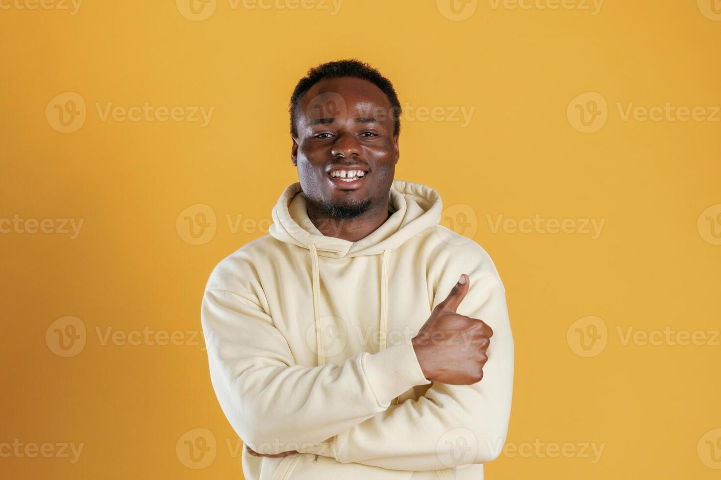 Black, guy is against yellow background photo