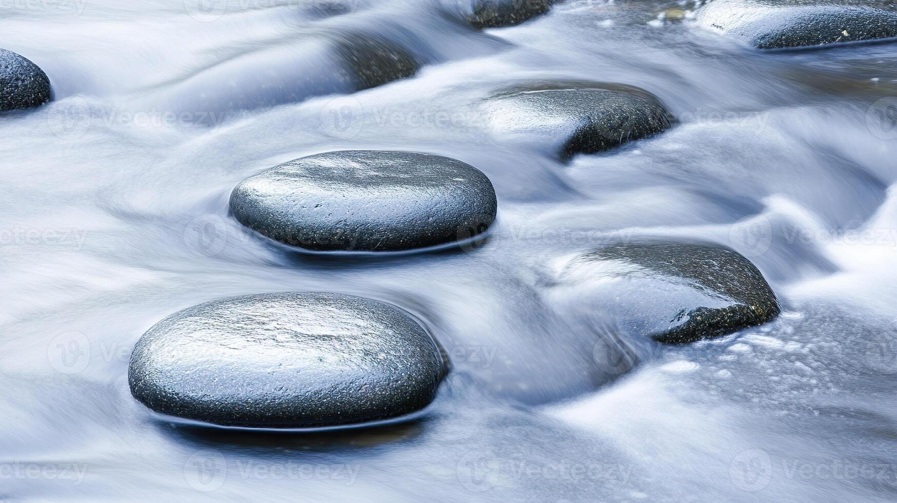 Serene river scene showing smooth stones with blurred water flowing around rocks Long exposure photo