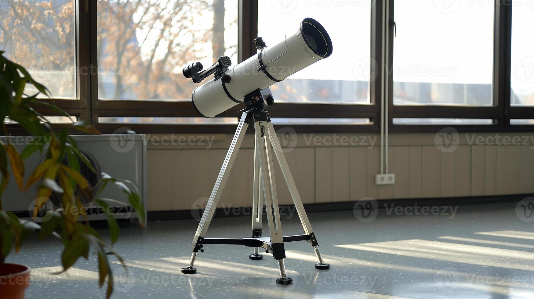 This telescope in a bright classroom invites students to explore concepts through observation. photo