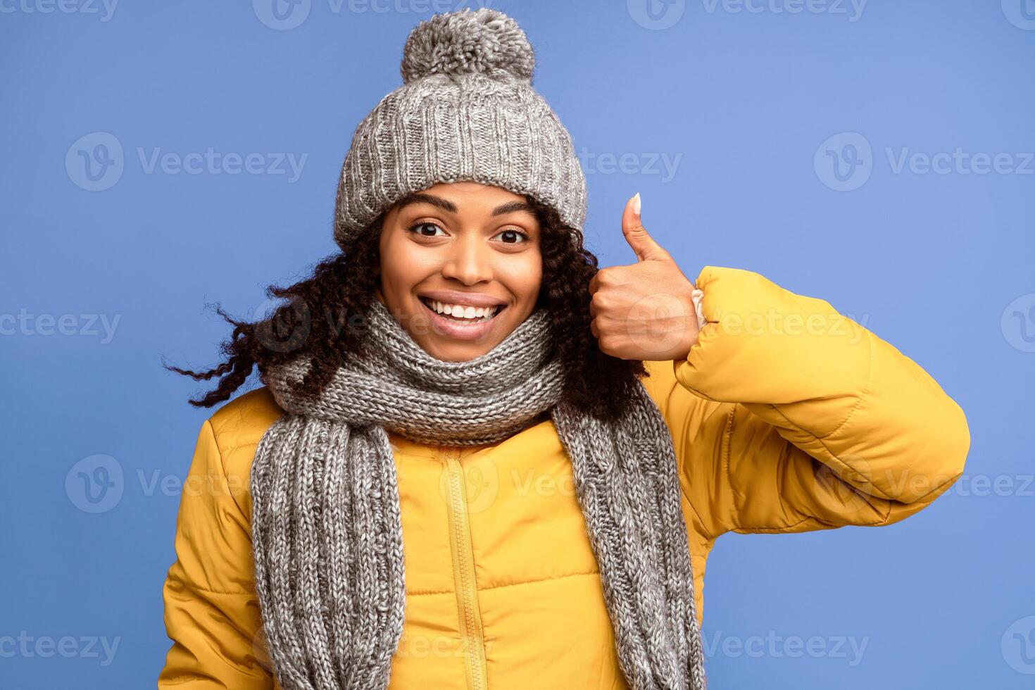 I Like It. African American Woman Gesturing Thumbs-Up Gesture Approving And Recommending Something Posing Standing Over Purple Studio Background, Smiling To Camera. Thumbs Up Concept photo