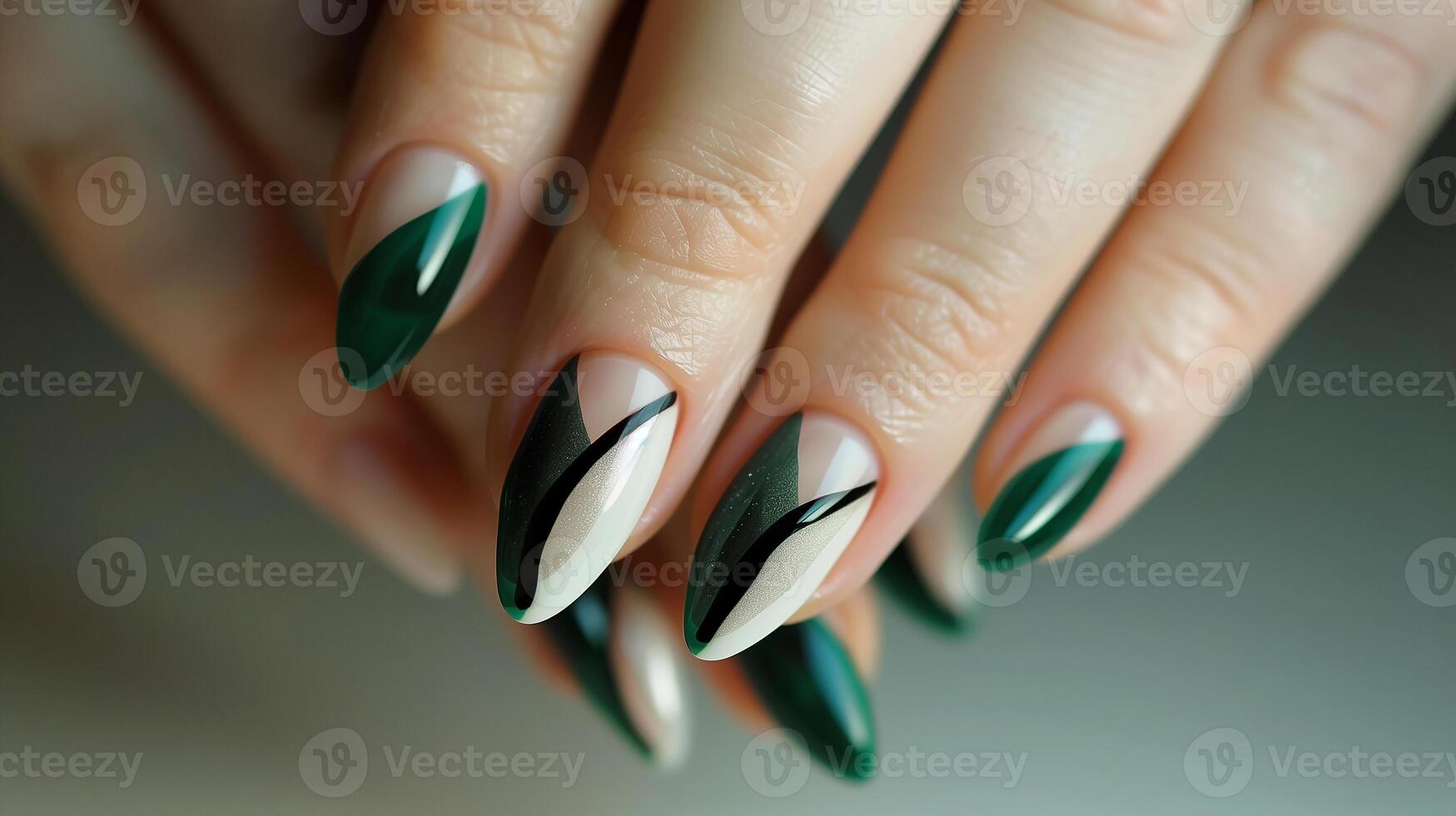 This Nail art showcases green and beige tones with unique patterns, highlighting handcare artistry. photo