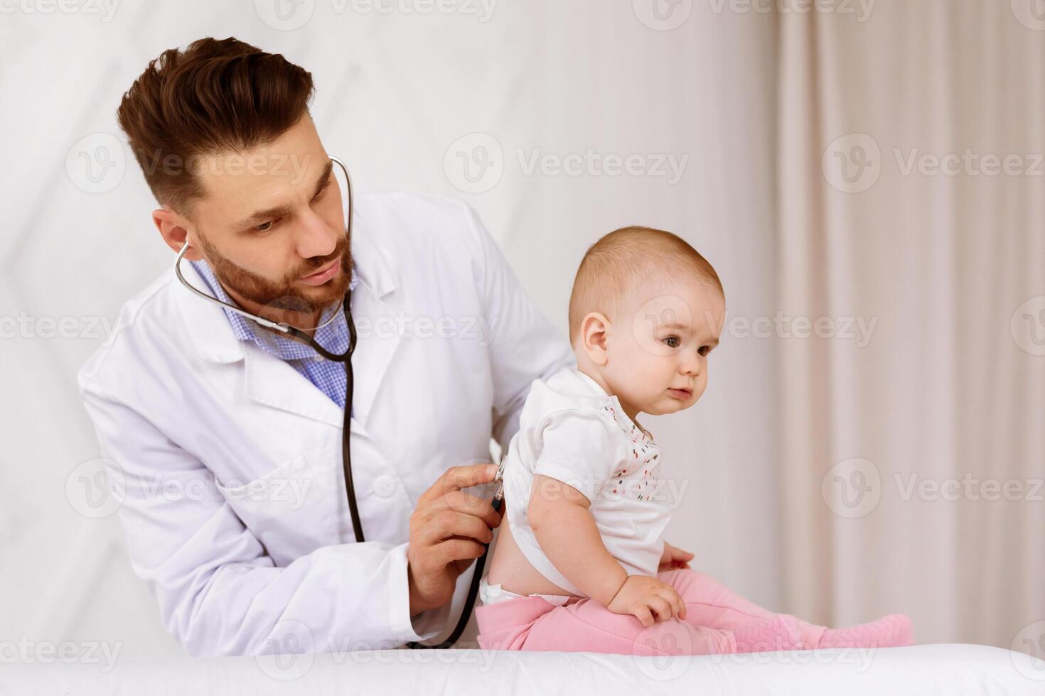 Doctor Examining Baby Toddler Listening To Lungs With Stethoscope Having Medical Checkup With Sick Little Patient In Clinic. Pediatrician's Appointment, Child And Healthcare Concept photo