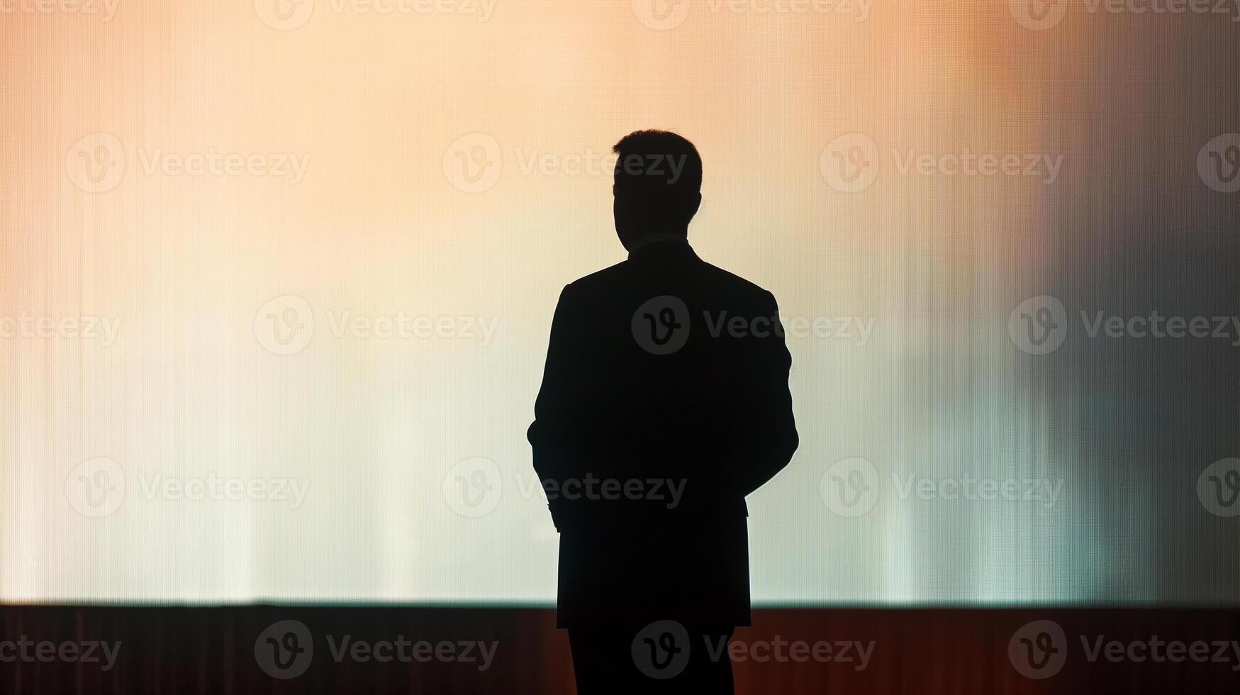 This speaker stands confidently at a podium, preparing for an engaging public address at a conference. photo