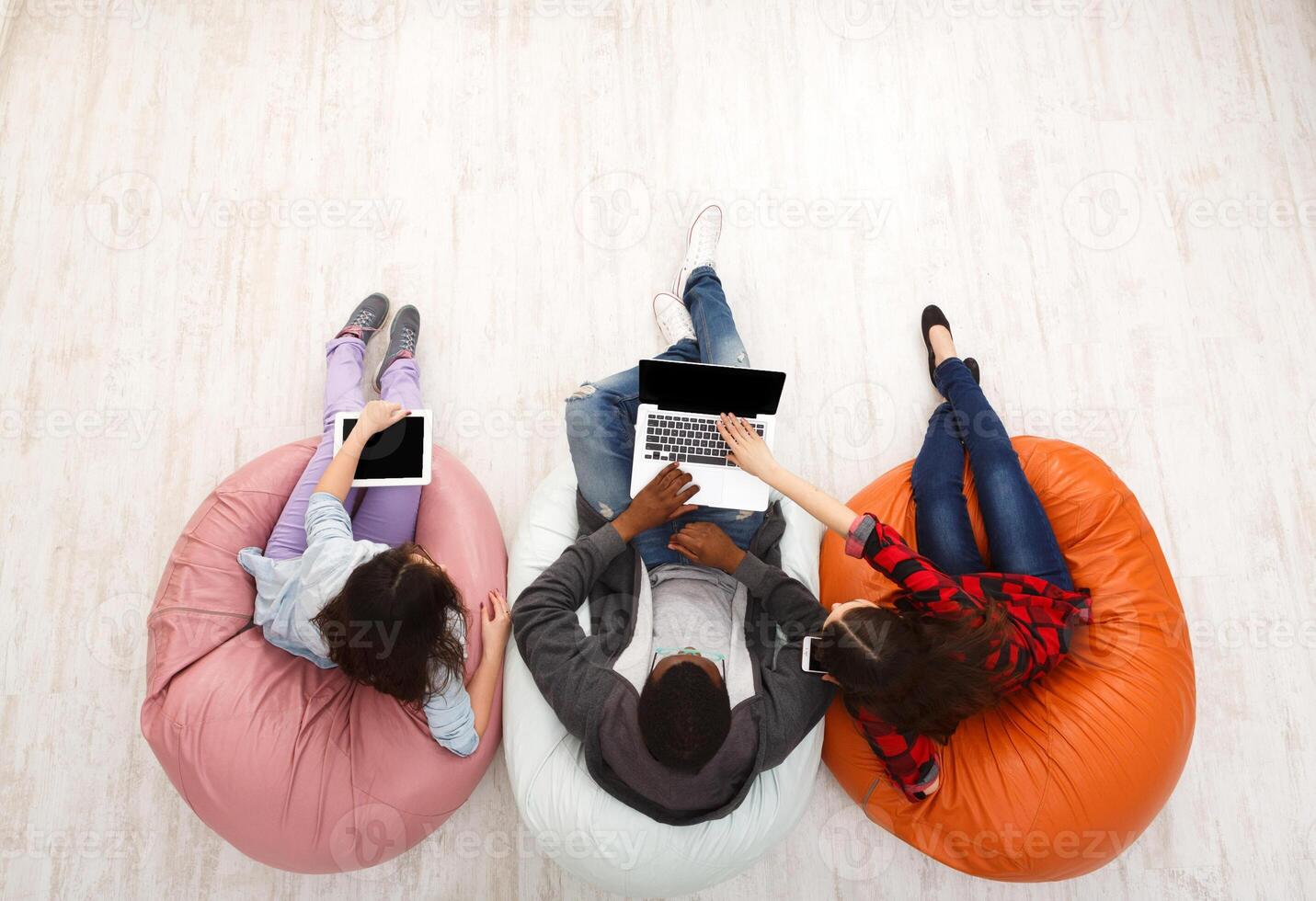 Gadgets and technology. Diverse people using smart devices, students preparing for exam at campus, top view photo