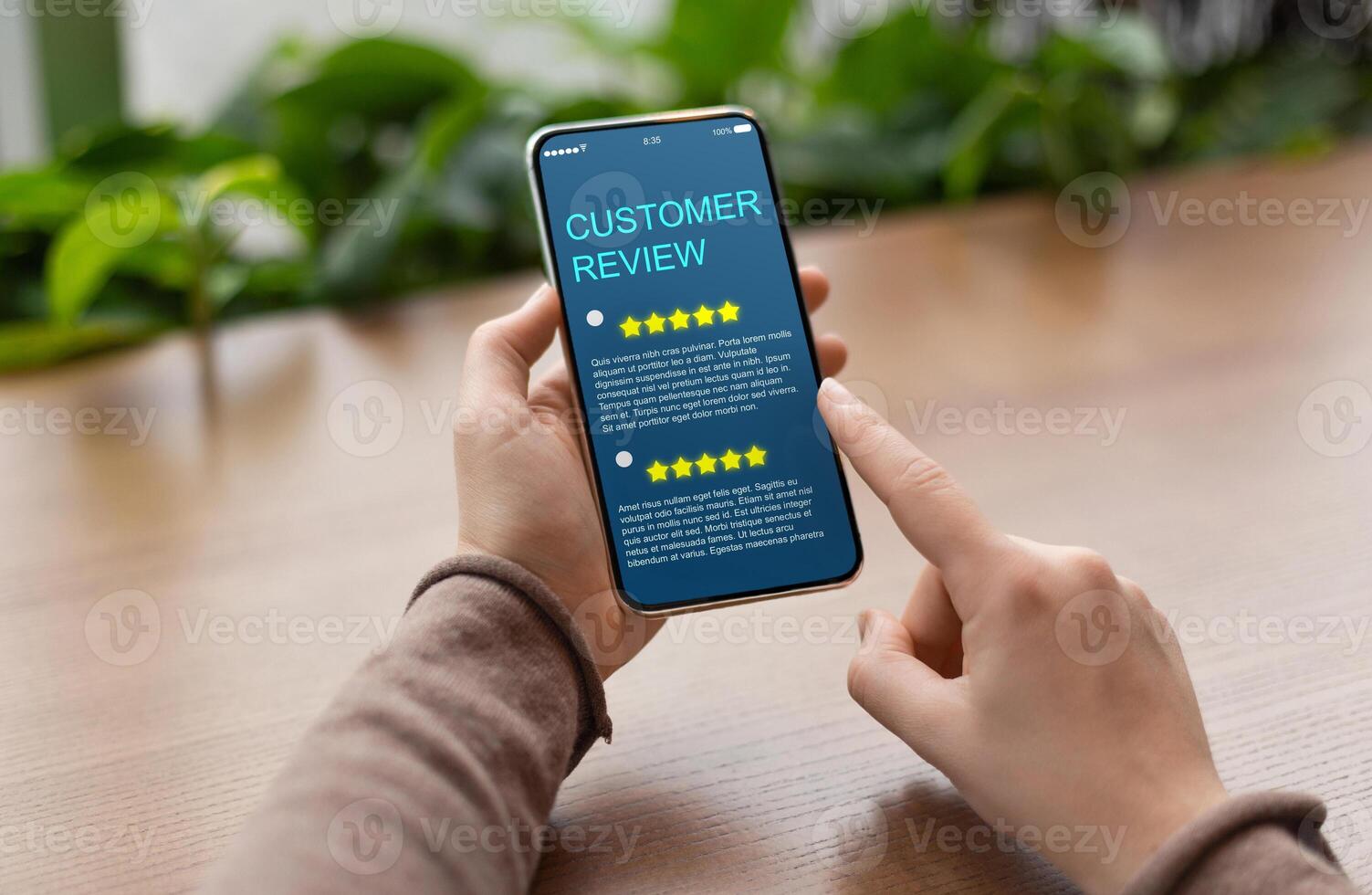 Consumer Showing cell phone with five star for Satisfaction rating on blue screen, blurred background. Customer Experience Concept photo