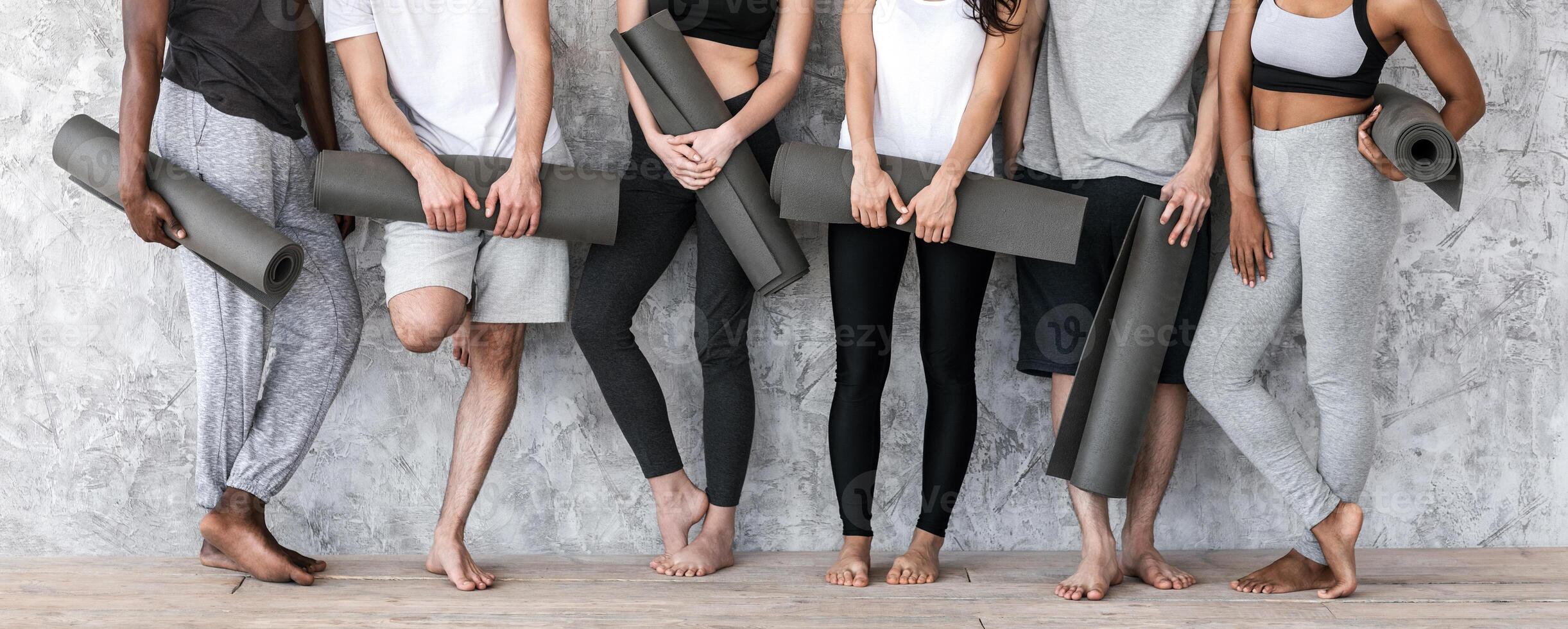 Diverse People In Sportswear With Yoga Mats In Hands Posing Near Wall, Cropped Image With Free Space, Panorama photo