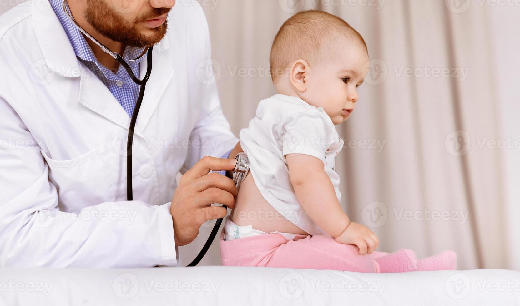 Medical Checkup. Doctor Examining Baby Girl Listening To Her Lungs Using Stethoscope In Hospital. Ill Little Patient Having Pediatrician Appointment In Clinic. Child Healthcare Concept. Cropped photo
