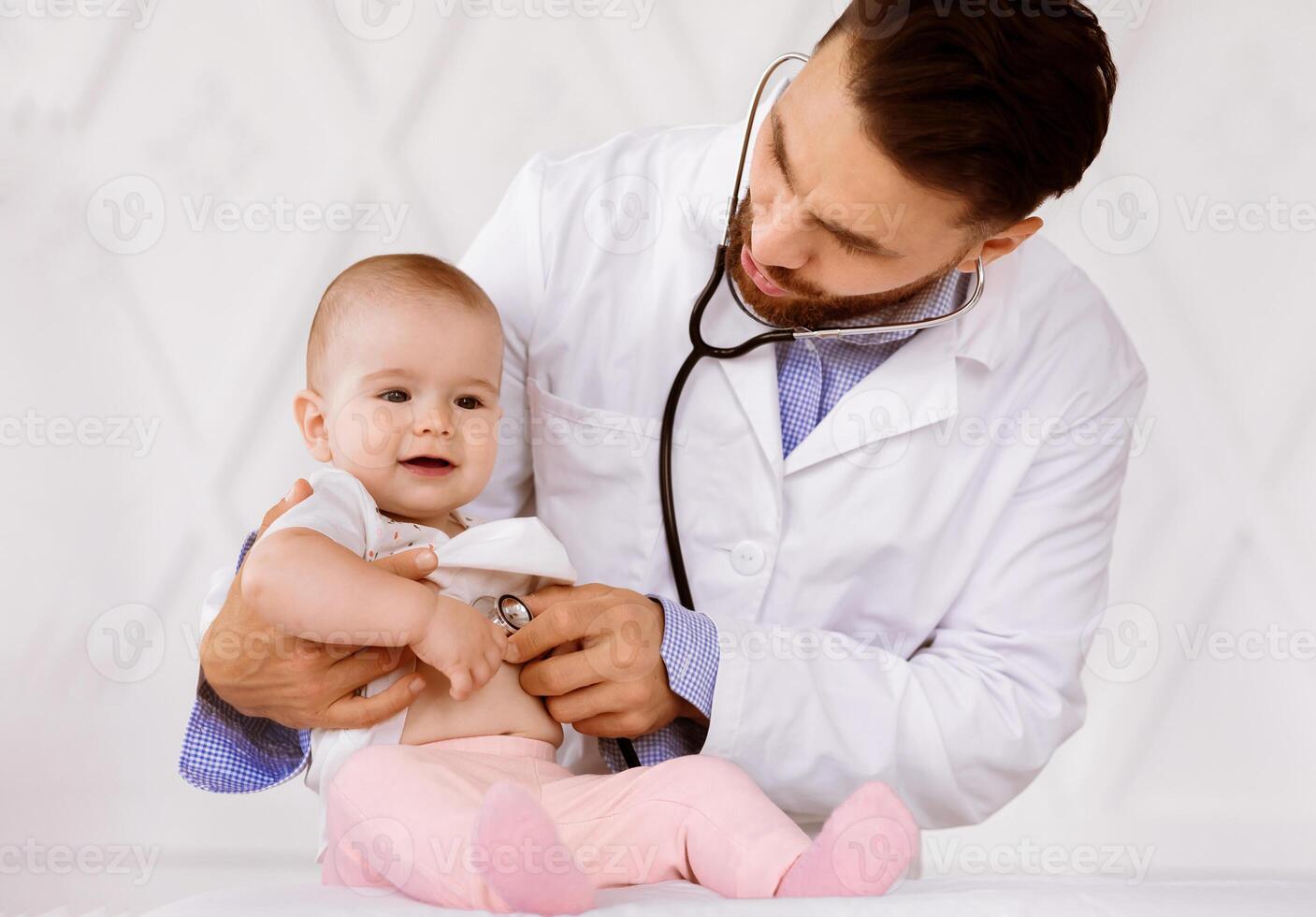 Doctor Examining Little Baby Girl Listening To Her Heartbeat With Stethoscope During Medical Checkup, Checking Heart And Lungs In Clinic. Sick Child Patient Having Appointment In Hospital photo