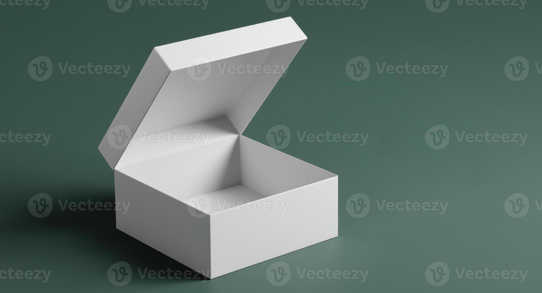 An open gift box sits on a smooth surface, inviting exploration of its unseen contents. The white box contrasts with the rich green backdrop, enhancing the anticipation of what awaits inside. photo