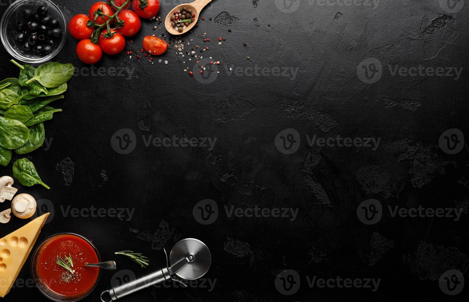 Pizza Cooking Ingredients On Black Background With Empty Space For Recipe photo