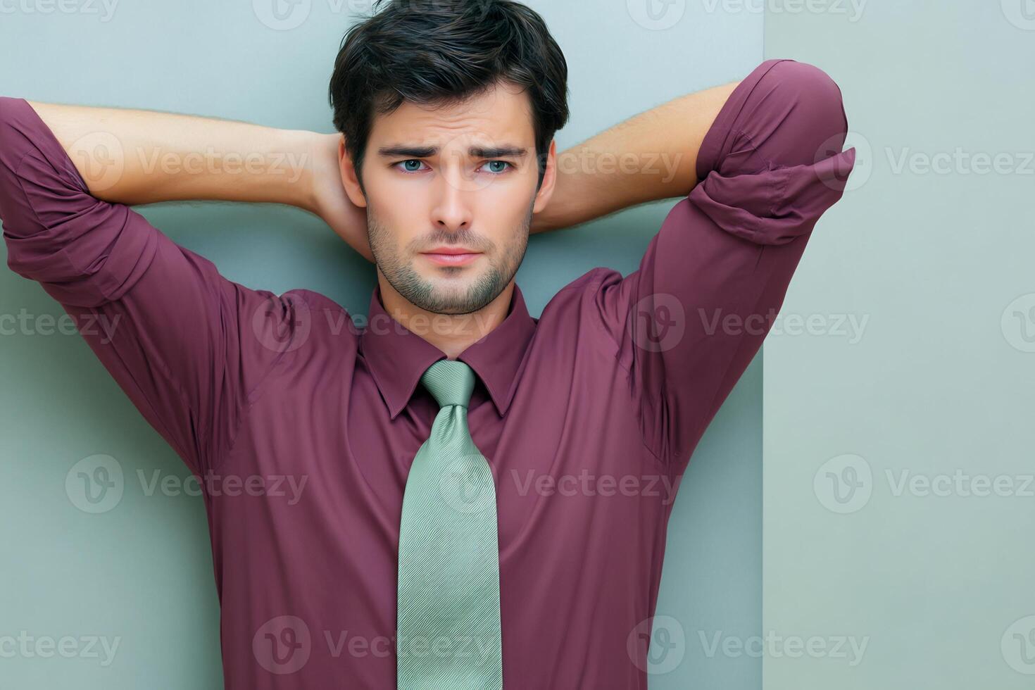 A man with his hands on his head photo