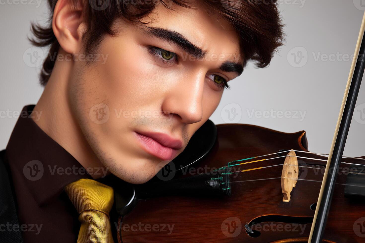 A man in a suit and tie playing a violin photo