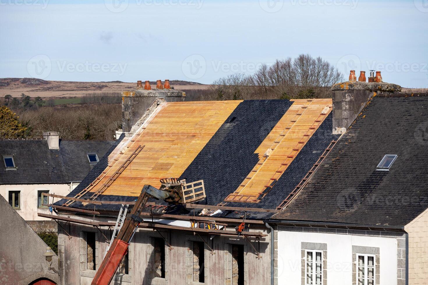 Changing a slate roof photo