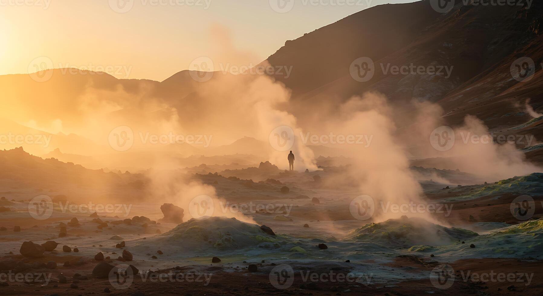Icelandic Geothermal Landscape with Steam and Silhouette at Sunrise photo