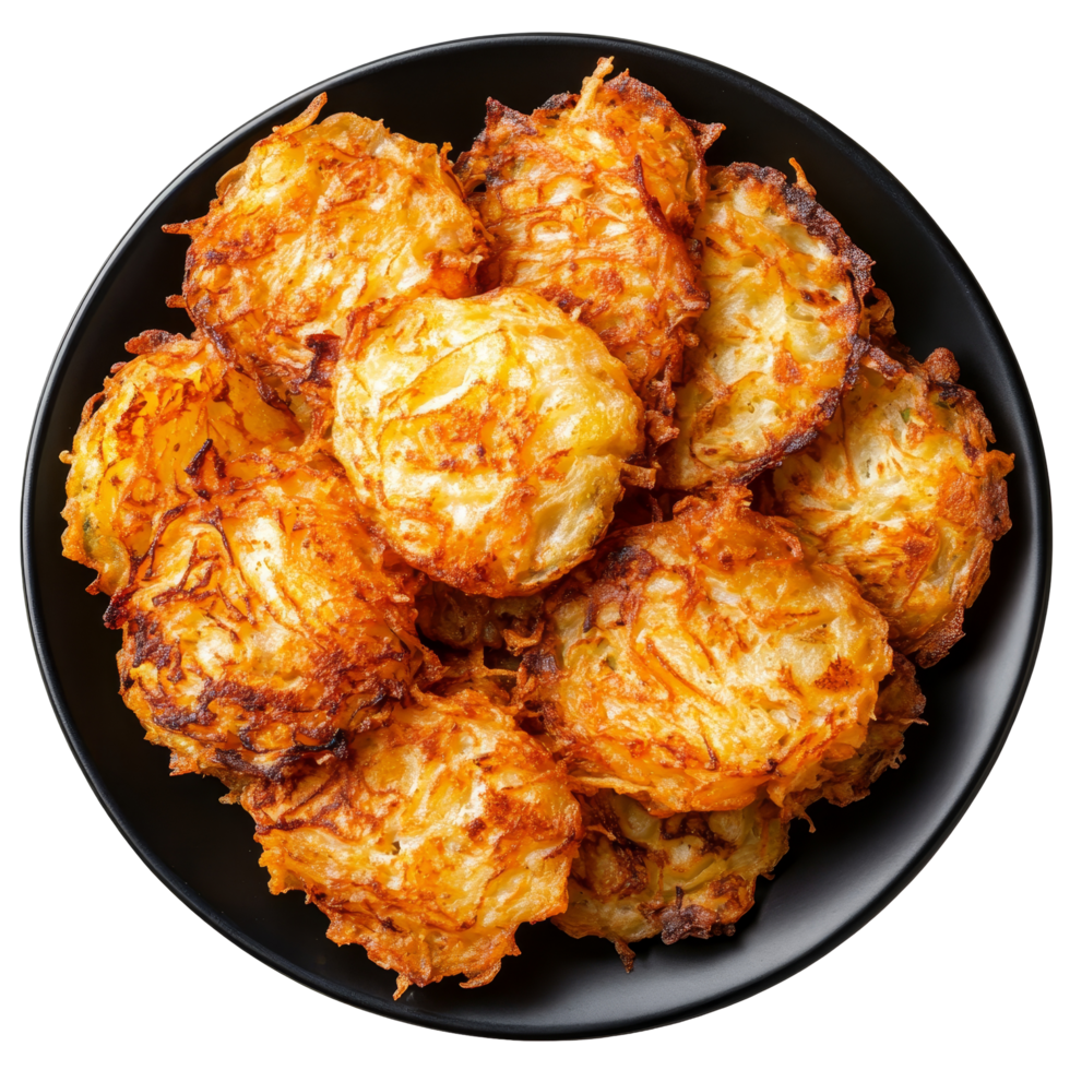 Crispy golden hash browns served on a black plate, viewed from above against a transparent background, Hash browns on black plate, top view, isolated transparent background png