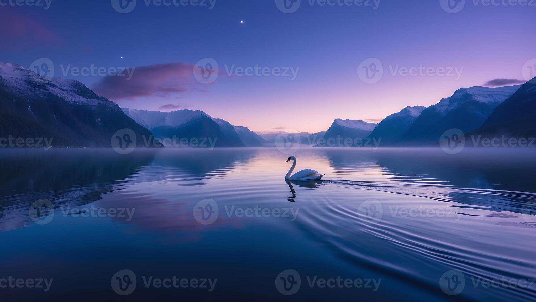 Swan Swimming on Calm Lake at Twilight with Mountain Backdrop photo