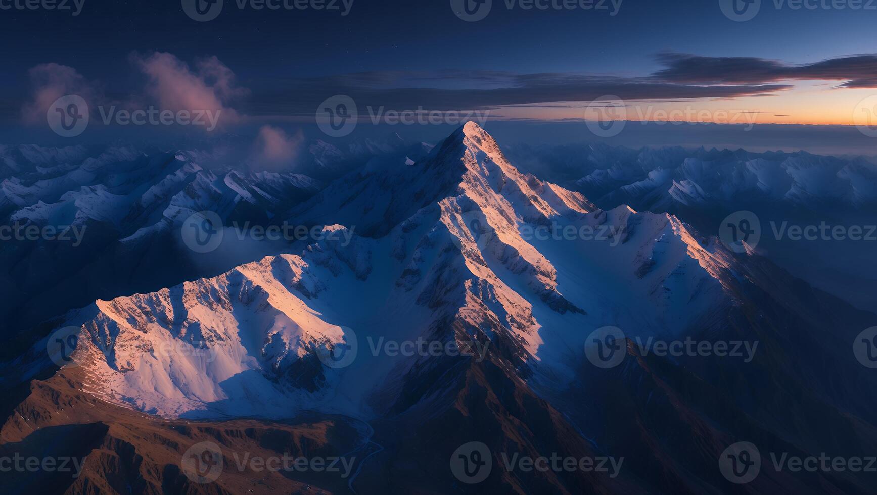 Snowy Mountain Peak at Dusk Majestic Landscape with Atmospheric Clouds photo