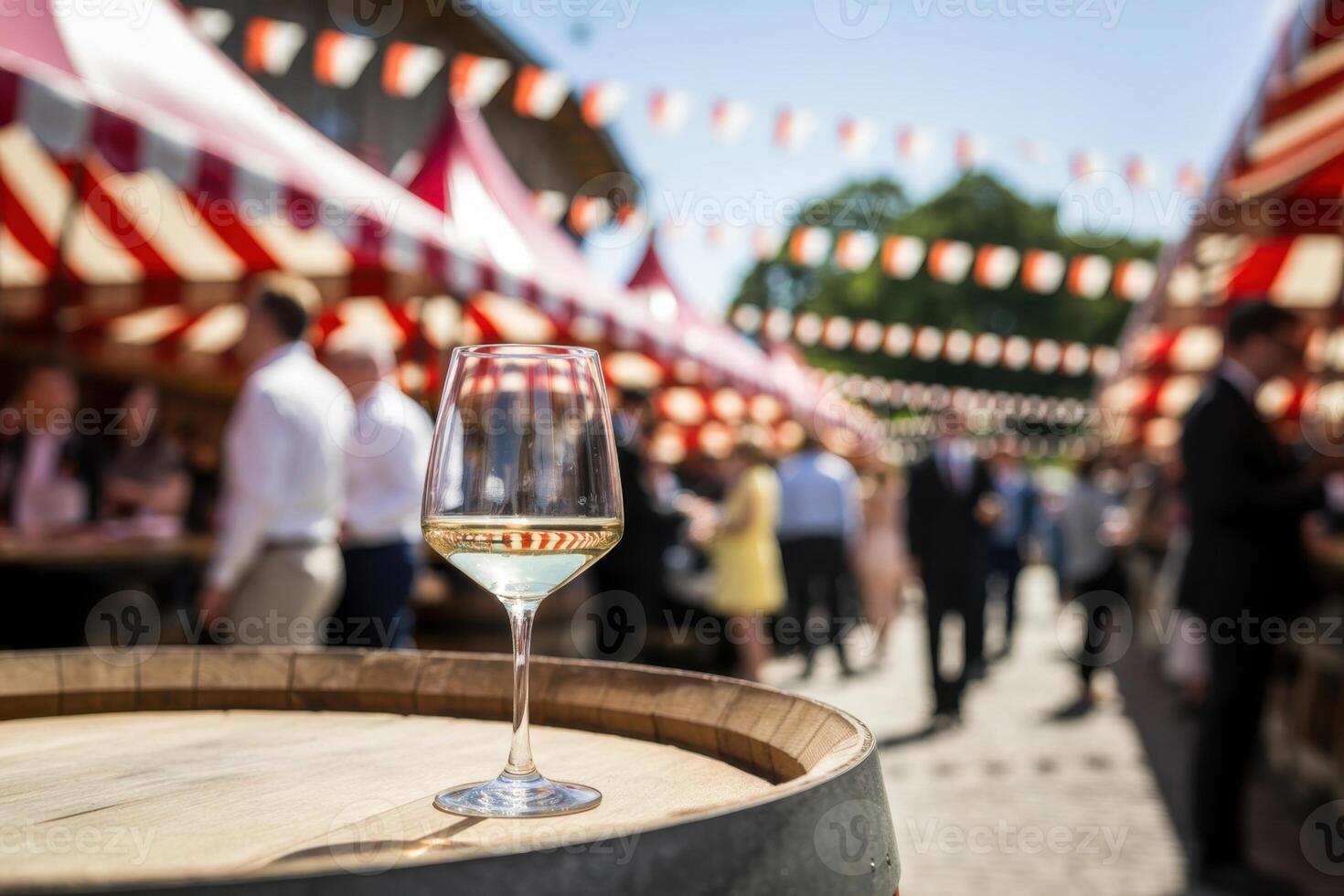 Glass of Wine on a Barrel at a Lively Outdoor Market with Colorful Canopies photo