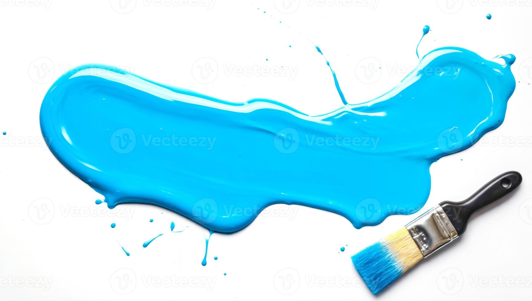 Paintbrush resting on spilled pool of glossy blue paint on white background photo