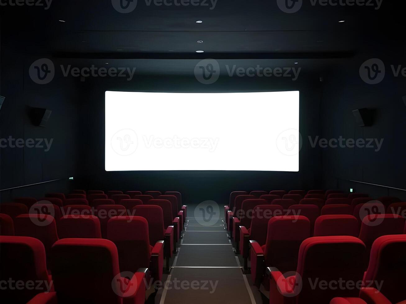 wide angle movie theater interior with red seats and large white screen in dark cinematic setting photo