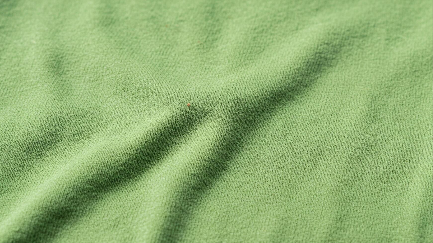 Close up dirty light green sports clothing fabric football shirt jersey texture photo