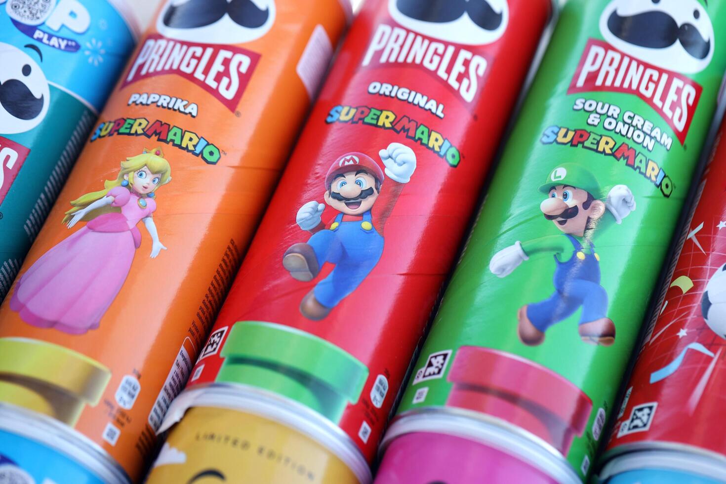 KYIV, UKRAINE - APRIL 19, 2025 Limited Edition Pringles tubes themed around Super Mario, featuring playful graphics and branding photo