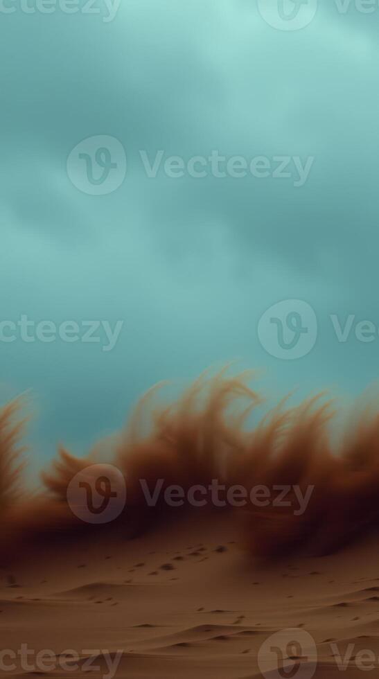 A dramatic sandstorm sweeps across the arid desert landscape with an ominous sky photo
