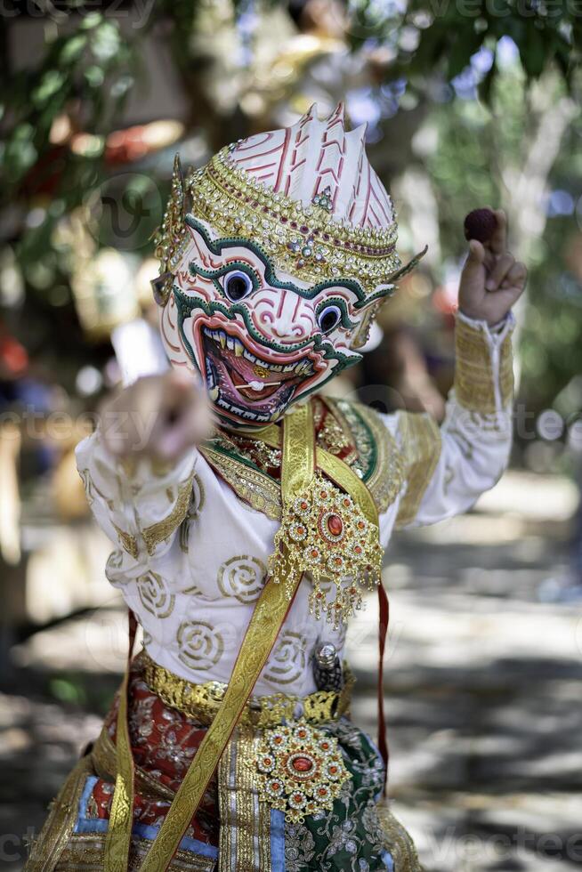 Khon is a rare Thai cultural performance. In the picture is a white monkey looking this way. photo