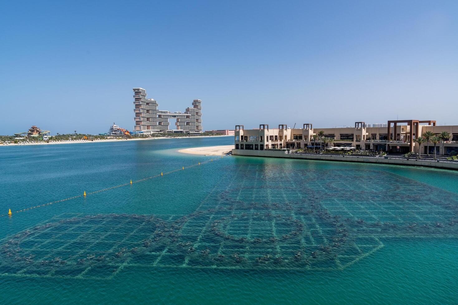 Dubai, United Arab Emirates - March 17, 2023-view of the hotel Atlantis The Royal on the background at Palm Jumeirah during a sunny day photo