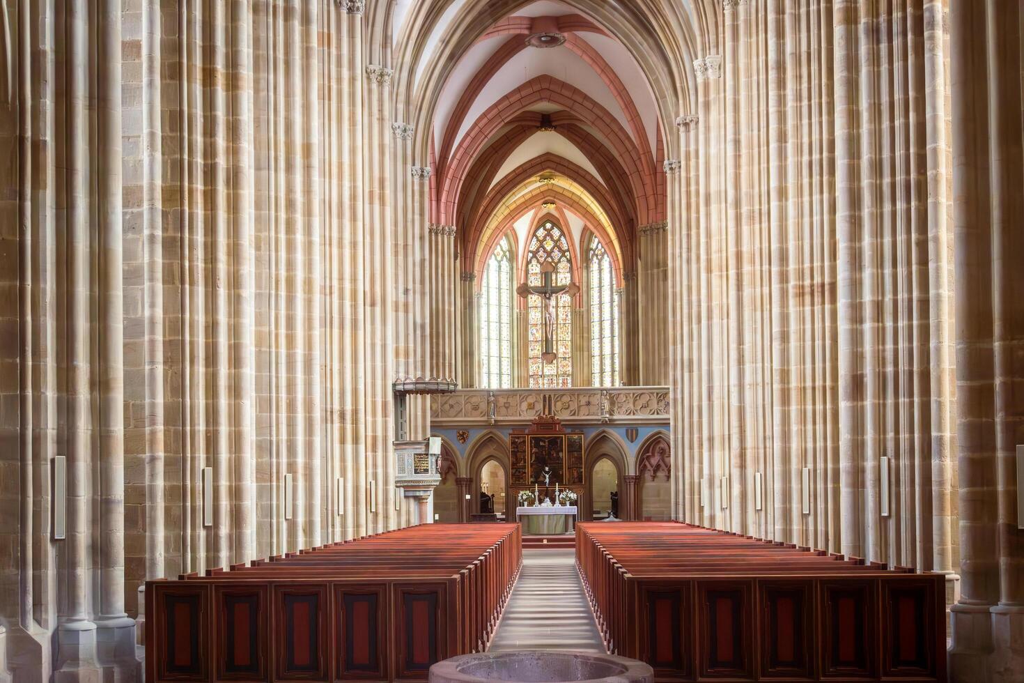 Meissen, Germany-august 17, 2022-Central nave with very tall columns, arches and holy water stoup inside the Maissen Cathedral during the day photo