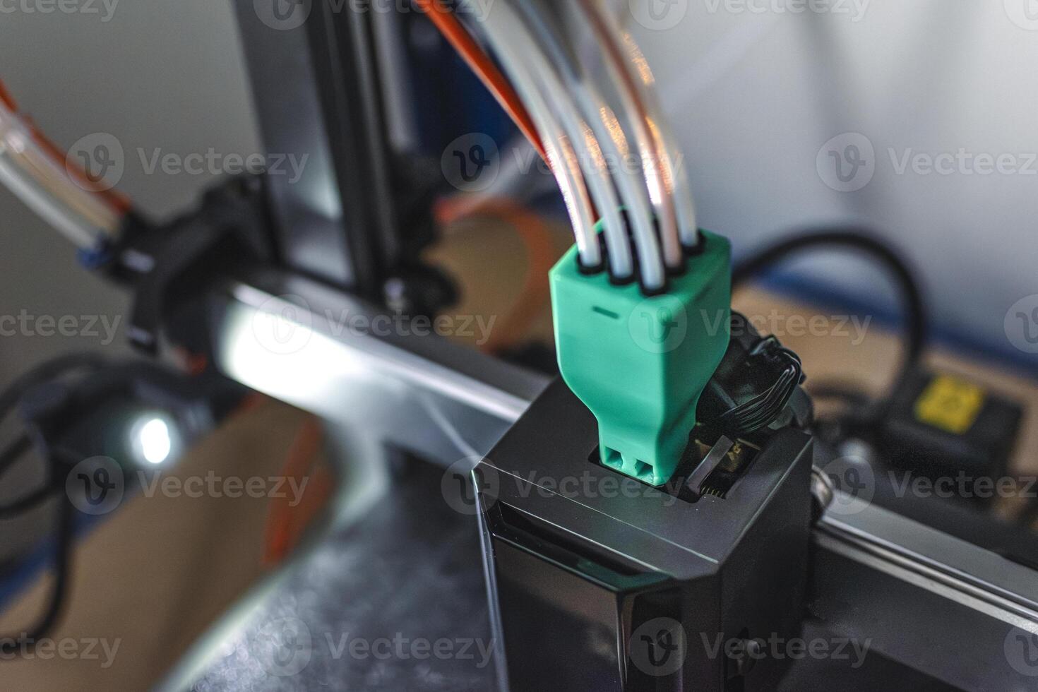 3d printer printing an object on the tray with pla filament, corn starch, non-waterproof filament, indoors photo