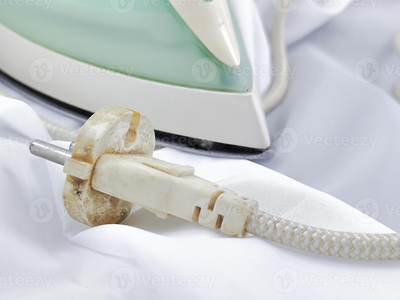 Ironing Clothes on White Fabric Background photo