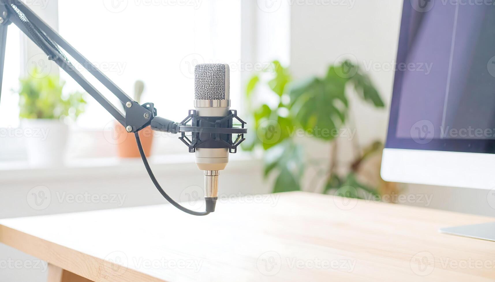 Professional Podcast Setup at Home Microphone, Laptop, and Accessories on the Desk photo