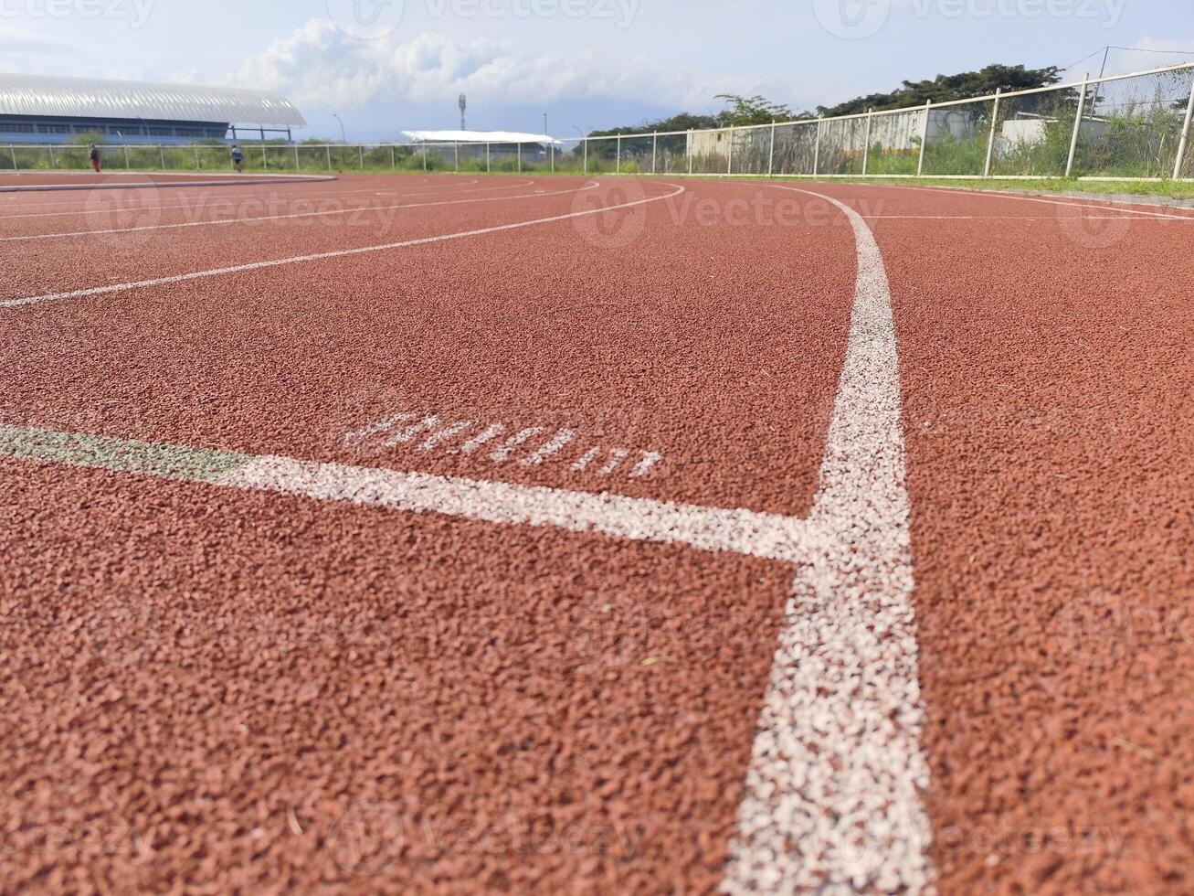 Running Track and Football Field with Clear Sky photo