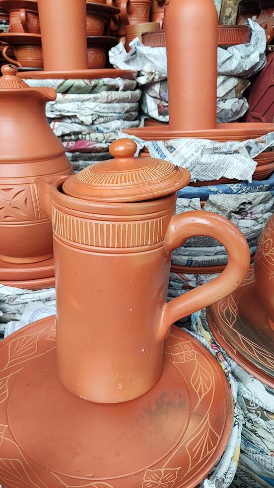A pile of clay pots and plates photo