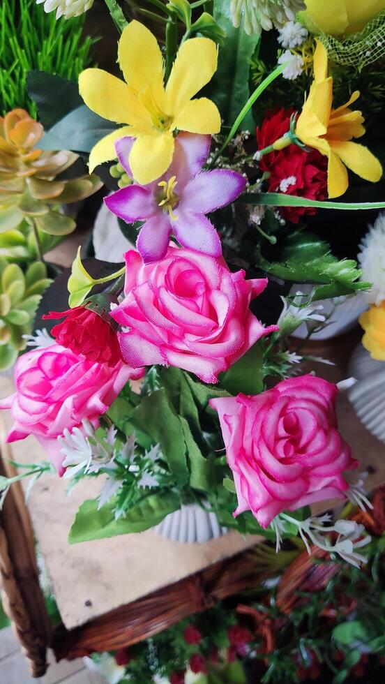 a vase filled with flowers and a basket with flowers photo