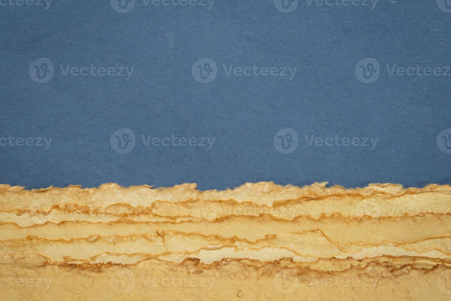abstract desert landscape created with sheets of textured handmade paper photo