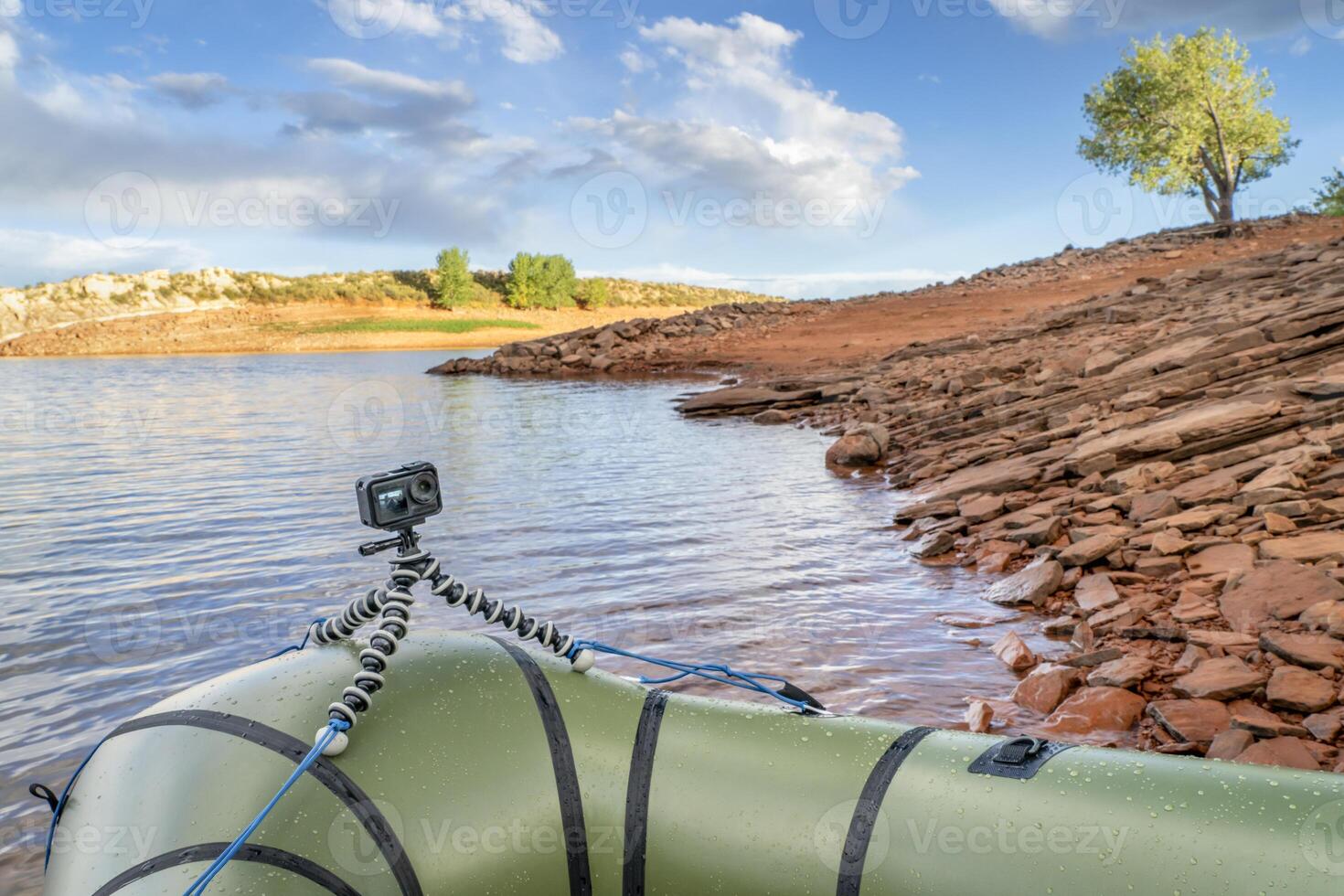 Packraft with action camera on a mountain lake in Colorado photo