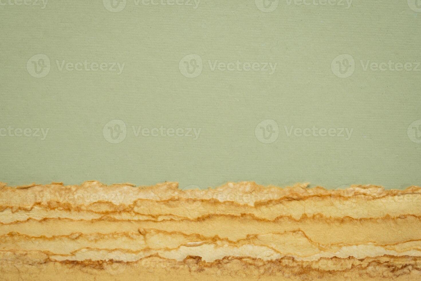 abstract desert landscape created with sheets of textured colorful handmade paper photo