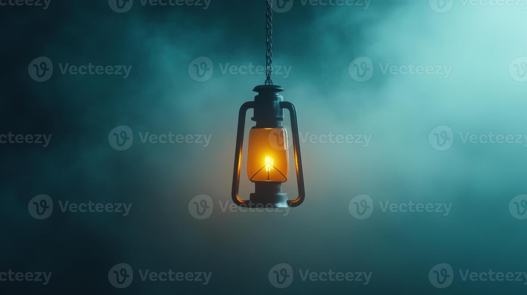 Illuminated lantern casting warm glow in dark, foggy environment for atmospheric ambiance and vintage charm photo