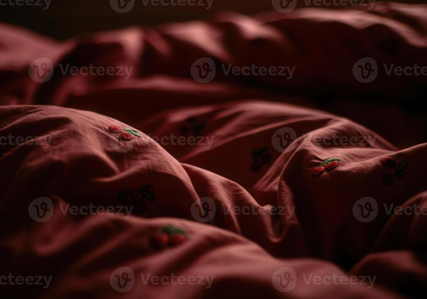 Textured fabric surface with subtle cherry embroidery in low light ambiance photo