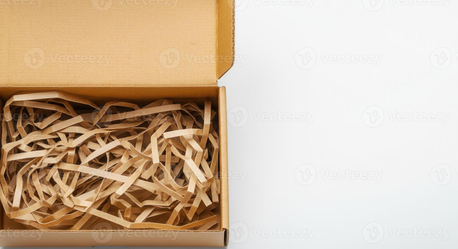 Cardboard box with paper shred fill for eco-friendly packaging solutions photo