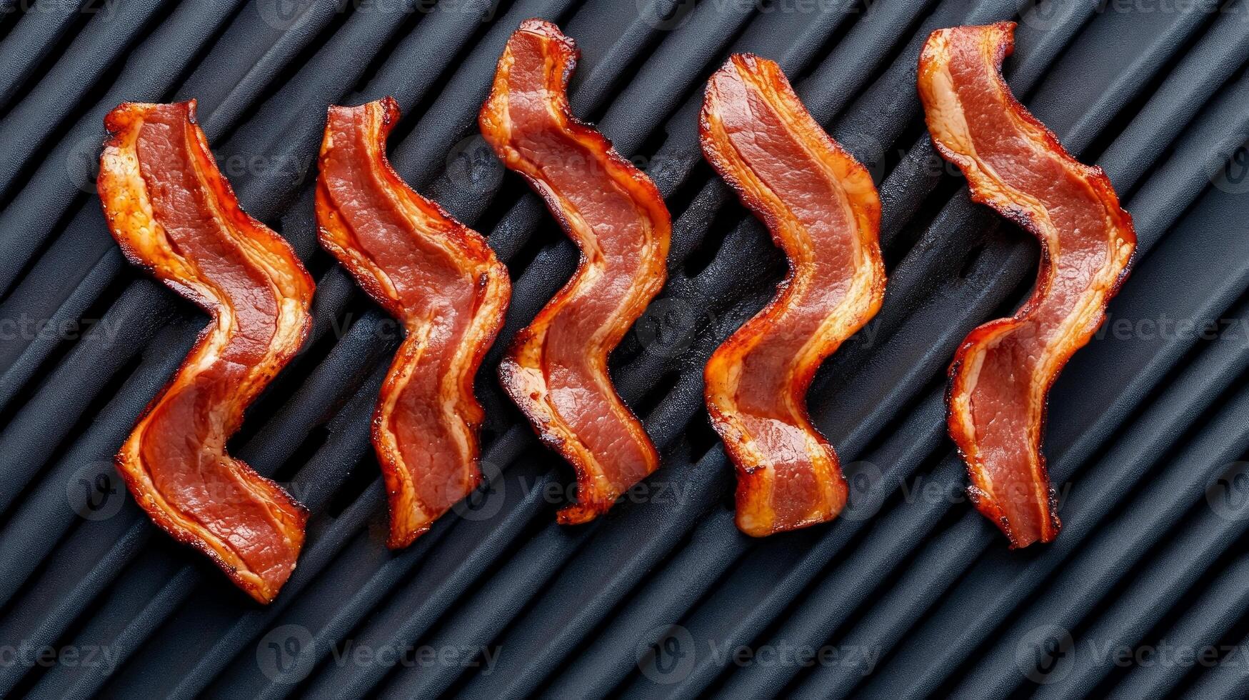 Deliciously cooked bacon strips lay perfectly on a grill, releasing irresistible smoky scents that evoke the joy of BBQ gatherings and summer fun photo