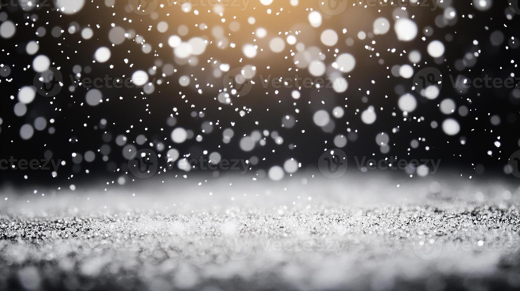 Snowflakes Falling on Dark Surface with Warm Bokeh Effect photo